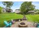 Large backyard with stone steps and firepit seating area at 10452 Quiet Bay Ct, Charlotte, NC 28278