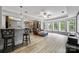 Finished basement with wet bar, entertainment area, recessed lighting, and large windows at 10452 Quiet Bay Ct, Charlotte, NC 28278