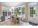 Bright breakfast nook features natural light and outdoor access to deck at 10452 Quiet Bay Ct, Charlotte, NC 28278