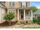 Charming front porch with stone steps, white columns, and manicured landscaping for curb appeal at 10452 Quiet Bay Ct, Charlotte, NC 28278
