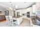 Open kitchen featuring stainless appliances, granite counters, an island cooktop and breakfast bar at 10452 Quiet Bay Ct, Charlotte, NC 28278