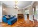 Elegant living room with hardwood floors, arched doorways, and classic trim detail at 10452 Quiet Bay Ct, Charlotte, NC 28278