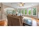 Bright living room with hardwood floors offers backyard views, arched doorways and a ceiling fan at 10452 Quiet Bay Ct, Charlotte, NC 28278