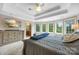 Bright main bedroom features a trey ceiling, bay windows and ensuite bath at 10452 Quiet Bay Ct, Charlotte, NC 28278