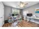 Bright office featuring hardwood floors, modern lighting, and a large window at 10452 Quiet Bay Ct, Charlotte, NC 28278