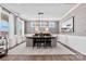 Elegant dining room featuring modern lighting, a large table, and stylish decor at 1102 Sugar Creek Rd, Indian Land, SC 29707