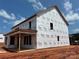 View of new home construction with the Tyvek wrap installed, roof in place, and window openings framed at 1102 Sugar Creek Rd, Indian Land, SC 29707