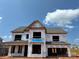 New construction home showing the exterior of a two-story residence with Tyvek wrap and a roof at 1102 Sugar Creek Rd, Indian Land, SC 29707