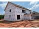 Exterior view of a framed home covered in Tyvek wrap, highlighting its construction phase at 1102 Sugar Creek Rd, Indian Land, SC 29707