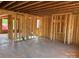 Interior view of new construction home showcasing the framed walls and headers on the first floor at 1102 Sugar Creek Rd, Indian Land, SC 29707