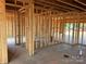 New construction interior view showcasing the stud walls, wiring boxes and concrete floor with paint markings at 1102 Sugar Creek Rd, Indian Land, SC 29707