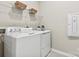 Functional laundry room with a front load washer and dryer, and wire shelving at 1102 Sugar Creek Rd, Indian Land, SC 29707
