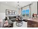 A cozy living room featuring a gray sectional sofa, stylish lighting, and theater decor at 1102 Sugar Creek Rd, Indian Land, SC 29707