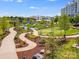 A modern community playground with slides and grassy areas, next to community buildings at 1102 Sugar Creek Rd, Indian Land, SC 29707