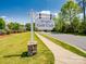 Springfield Golf Club sign on manicured lawn, offering an inviting entrance to the community at 1102 Sugar Creek Rd, Indian Land, SC 29707