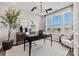 Bright and airy study featuring a modern chandelier, a spacious desk, and a comfortable armchair at 1102 Sugar Creek Rd, Indian Land, SC 29707