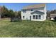 The backyard features a trampoline, furniture, and green grass at 112 Paradise Hills Cir, Mooresville, NC 28115