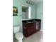 The bathroom features a toilet, and a dual sink vanity with dark countertop and large mirror at 112 Paradise Hills Cir, Mooresville, NC 28115