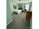 This bedroom features carpeted floors, a bed, a nightstand, a desk, and a window at 112 Paradise Hills Cir, Mooresville, NC 28115