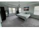 Serene bedroom with tray ceilings, ample natural light, and calming decor at 112 Paradise Hills Cir, Mooresville, NC 28115
