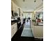 Open kitchen features stainless appliances, granite counters, and seamless flow to a sun-lit living area at 112 Paradise Hills Cir, Mooresville, NC 28115