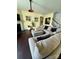 Another view of the cozy living room featuring a fireplace, comfortable seating, and a relaxing ambiance at 112 Paradise Hills Cir, Mooresville, NC 28115