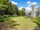 Expansive backyard with lush green grass and mature trees, perfect for outdoor activities at 11332 Ridge Oak Dr, Charlotte, NC 28273