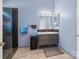 Modern bathroom featuring a glass shower door, updated vanity, and storage at 11332 Ridge Oak Dr, Charlotte, NC 28273