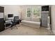 This bedroom is set up as an office space with lots of natural light at 11332 Ridge Oak Dr, Charlotte, NC 28273