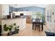 Well-lit kitchen with stainless appliances, modern cabinetry, and adjacent dining area at 11332 Ridge Oak Dr, Charlotte, NC 28273
