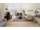 Bright living room featuring a cozy fireplace, comfortable seating, and lots of natural light at 11332 Ridge Oak Dr, Charlotte, NC 28273