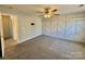 Spacious bedroom with geometric accent wall, ceiling fan, and neutral carpet at 1176 Constitution Park Blvd, Rock Hill, SC 29732
