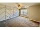 Bedroom with modern wall design, ceiling fan, and window providing natural light at 1176 Constitution Park Blvd, Rock Hill, SC 29732