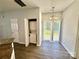 Dining area with wood floors, a sliding door to the backyard, and a chandelier above at 1176 Constitution Park Blvd, Rock Hill, SC 29732