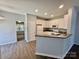 Updated kitchen with white cabinets, granite countertops, stainless appliances, and a breakfast bar at 1176 Constitution Park Blvd, Rock Hill, SC 29732
