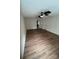 Open living room featuring ceiling fan, neutral walls, and wood-look flooring at 135 Locomotive Ln # 106, Mooresville, NC 28115