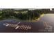 Aerial view showcases the property's planned boat slips and proposed kayak launch location on the serene waters at 1360 Dali Blvd, Mount Holly, NC 28120