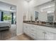 Bathroom with double vanities, granite countertops, modern fixtures, and a walk-in shower at 1360 Dali Blvd, Mount Holly, NC 28120