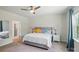 Cozy bedroom with ceiling fan, neutral decor, soft carpet and en suite bathroom at 1360 Dali Blvd, Mount Holly, NC 28120