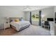 Comfortable bedroom featuring a serene color palette, plush carpet, and a large window at 1360 Dali Blvd, Mount Holly, NC 28120