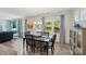 Formal dining area with ample light from outdoor views and dining table with seating for six at 1360 Dali Blvd, Mount Holly, NC 28120