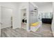 Open hallway showcases a functional laundry room, stylish decor, and seamless transition to the living area at 1360 Dali Blvd, Mount Holly, NC 28120