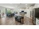Open kitchen features a large island with seating, modern appliances, and a view of the dining area at 1360 Dali Blvd, Mount Holly, NC 28120