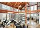 Inviting library space featuring floor-to-ceiling bookshelves, comfortable seating, and ample natural light at 1360 Dali Blvd, Mount Holly, NC 28120