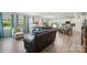 Spacious living room with abundant natural light, hardwood floors, and seamless flow to kitchen and dining areas at 1360 Dali Blvd, Mount Holly, NC 28120