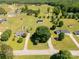 This aerial view showcases a home on a lot surrounded by lush trees and green grass at 1560 Springlake Rd, York, SC 29745