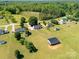 This aerial view shows a home with large yard with a mix of trees and green grass at 1560 Springlake Rd, York, SC 29745