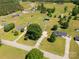 This aerial view features a home on a lot surrounded by lush trees and green grass at 1560 Springlake Rd, York, SC 29745
