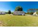 Backyard featuring a large grassy area and deck at 1560 Springlake Rd, York, SC 29745