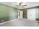 Bright bedroom with ceiling fan, closet, and carpet at 1560 Springlake Rd, York, SC 29745